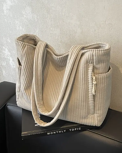 Tilda – Bolsa de mano acanalada con detalle de cordón**