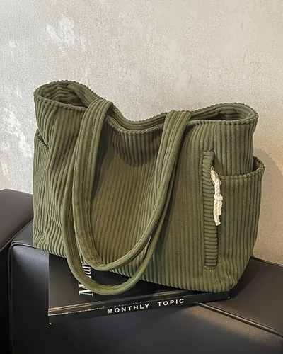Tilda – Bolsa de mano acanalada con detalle de cordón**